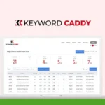 Screenshot of a laptop displaying the Keyword Caddy tool's dashboard, featuring keyword analytics and performance data. The tool's logo is at the top center. A green SAS Guru Reviews badge is visible on the top left, highlighting its standing in a KeywordCaddy Review for comprehensive insights as an SEO tool.