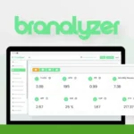Laptop displaying Brandlyzer dashboard with metrics on traffic, revenue, and other business data for agencies. Branding and logo included.