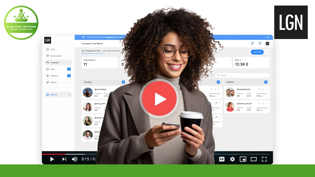 A woman with curly hair holds a smartphone and a coffee cup, standing in front of a computer screen displaying a Social Media Mastery dashboard. A play button is overlaid on the image.